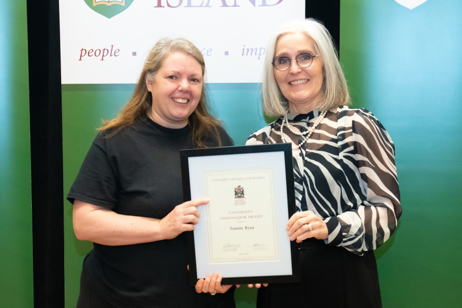 Tammy Ryan, Service Worker with UPEI Facilities Management, accepts the University Ambassador Award from Dr. Wendy Rodgers, UPEI President and Vice-Chancellor.