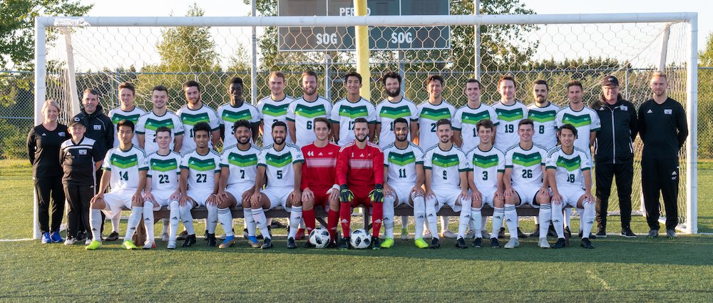 UPEI men's soccer team photo in front of a goal
